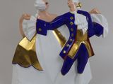 a figurine of a man and a woman dancing