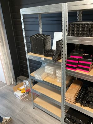 a shelf with many different items on it in a room