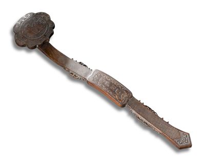 une image représentant un couteau muni d'un manche sur fond blanc