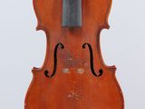 an old violin with a bow hanging from it ' s back