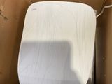 a toilet in a cardboard box with a white cover