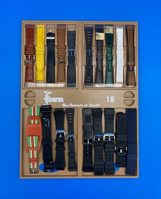 une boîte contenant tout un tas de montres différentes