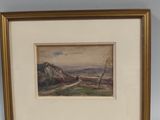 tableau encadré représentant un paysage avec un bateau sur l'eau