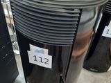 a black and silver air conditioner sitting on the floor