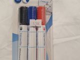 three pens that are in a package on a table