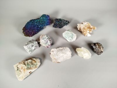 a close up of a group of crystals on a white surface