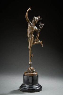 an image of a bronze statue of a woman on a pedestal