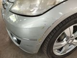 a picture of a car with a denting dent on it