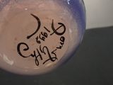 a blue and white vase with writing on it