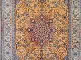 an oriental rug with a medallion design on a blue ground