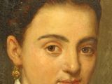 portrait of a woman in a black dress with a white shirt and gold earrings