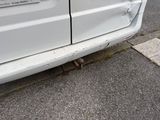 a white van parked on the side of the street
