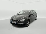 the black car is parked in a white room with a white floor