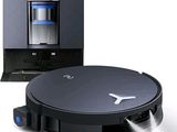 an image of a robotic vacuum cleaner is shown next to a coffee machine