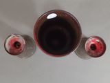 three wine glasses sitting next to each other on a table