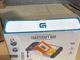 a cardboard box with a toaster on it sitting on the floor