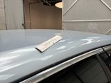 a sticker on the roof of a car that is parked in a garage