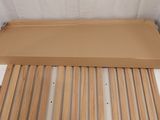 the bed frame is made of wood and has slats on it