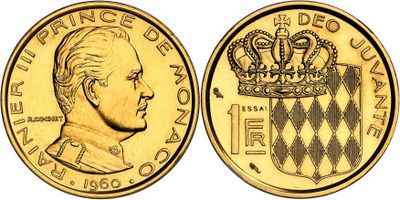 a close up of a gold coin with a crown on it