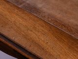 a wooden table with a tile top on it