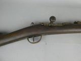 an old gun is displayed on a white surface with a white background