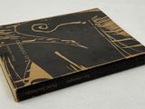 a black and gold book with a picture on it