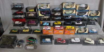 many different types of toy cars in the display case