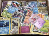 a box full of pokemon cards sitting on top of a table