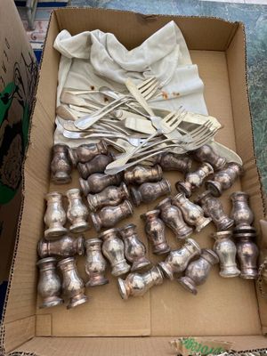 a box full of silverware and forks and spoons
