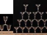 a lot of wine glasses sitting on a table