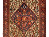tapis persan ancien à motifs bleus et rouges