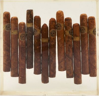 a lot of cigars that are in a glass case