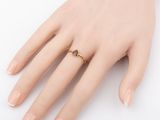 an image of a woman ' s hand with a ring on it ' s finger