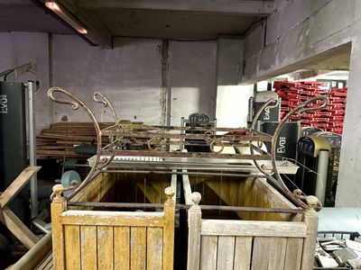 a room with a bunch of wooden crates in it
