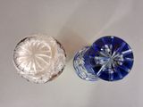 pair of blue and clear glass knobs on a white surface