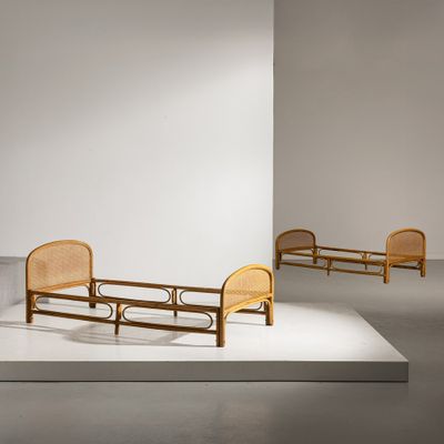three chairs and a bed in the middle of a room