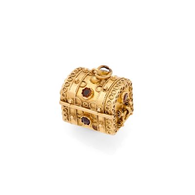 a gold - plated box charm with garnets on it