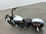 a motorcycle that is parked on the concrete floor