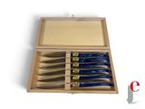 five knives in a wooden box on a white surface