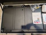 a metal box with a bunch of items inside of it