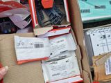 a box full of electronic equipment that is sitting on the ground