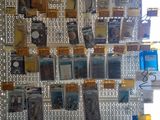 a wall with many pictures hanging on it in a room