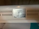 an image of a close up of a microwave oven with a label on it