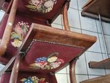 a lot of chairs that are stacked on top of each other
