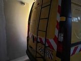 a van that is parked in a building under construction