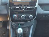 a car dashboard with a car radio and a steering control
