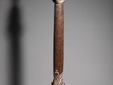 a close up of a wooden object with a bird on it