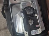 a camera in a bag that is sitting on the floor