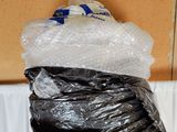 a bag of plastic wrapped in plastic wrap on top of a table