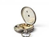 a silver pocket watch that is open on a white surface